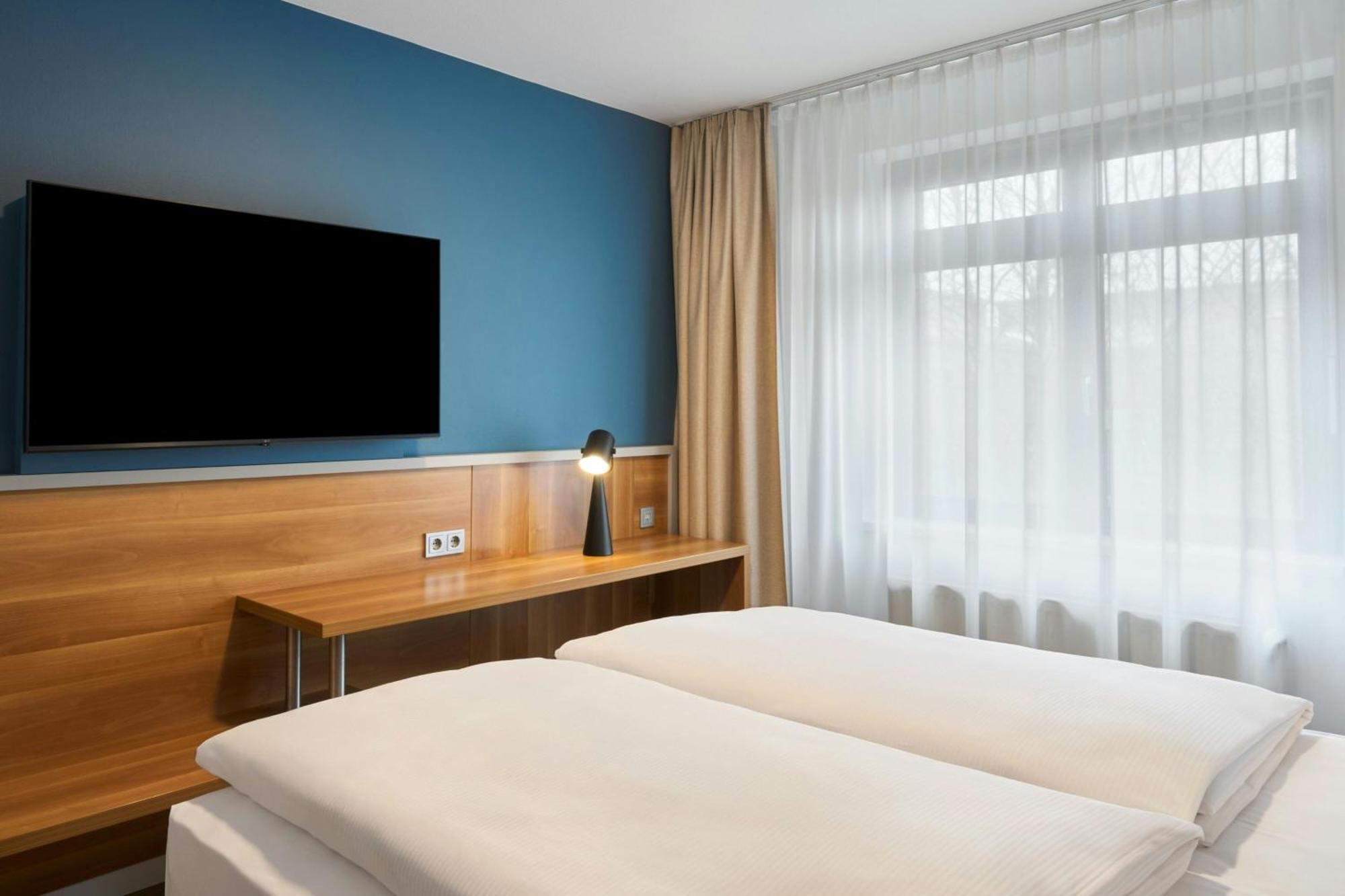 Standaard Kamer met Queensize Bed en Uitzicht op Tuin